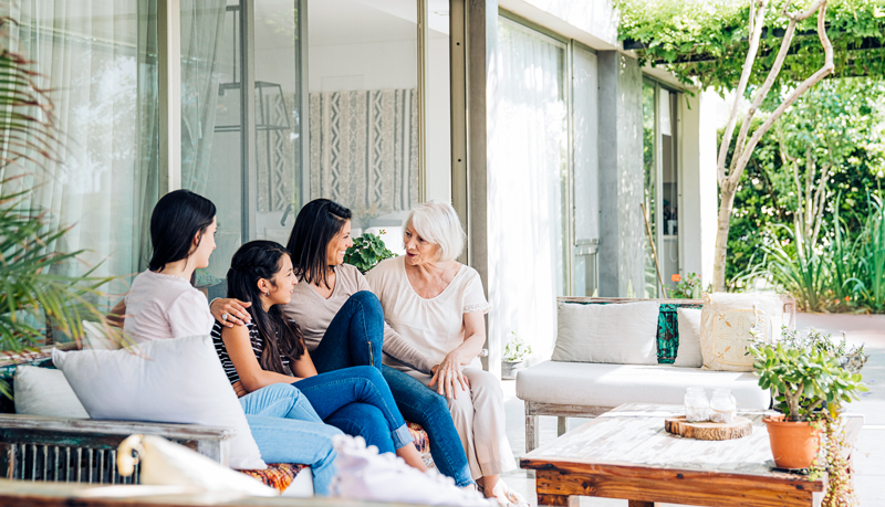 Family with teen talking on patio - Alliant Private Client